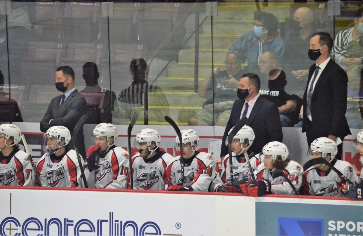 Andy Delmore, Marc Savard, and Jerrod Smith