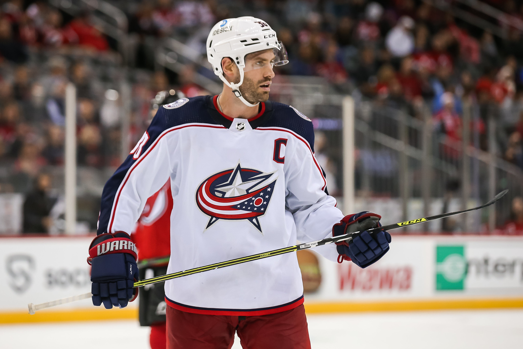 NHLPA - Boone Jenner autographs his game jersey for a young fan yesterday  in Columbus. Columbus Blue Jackets