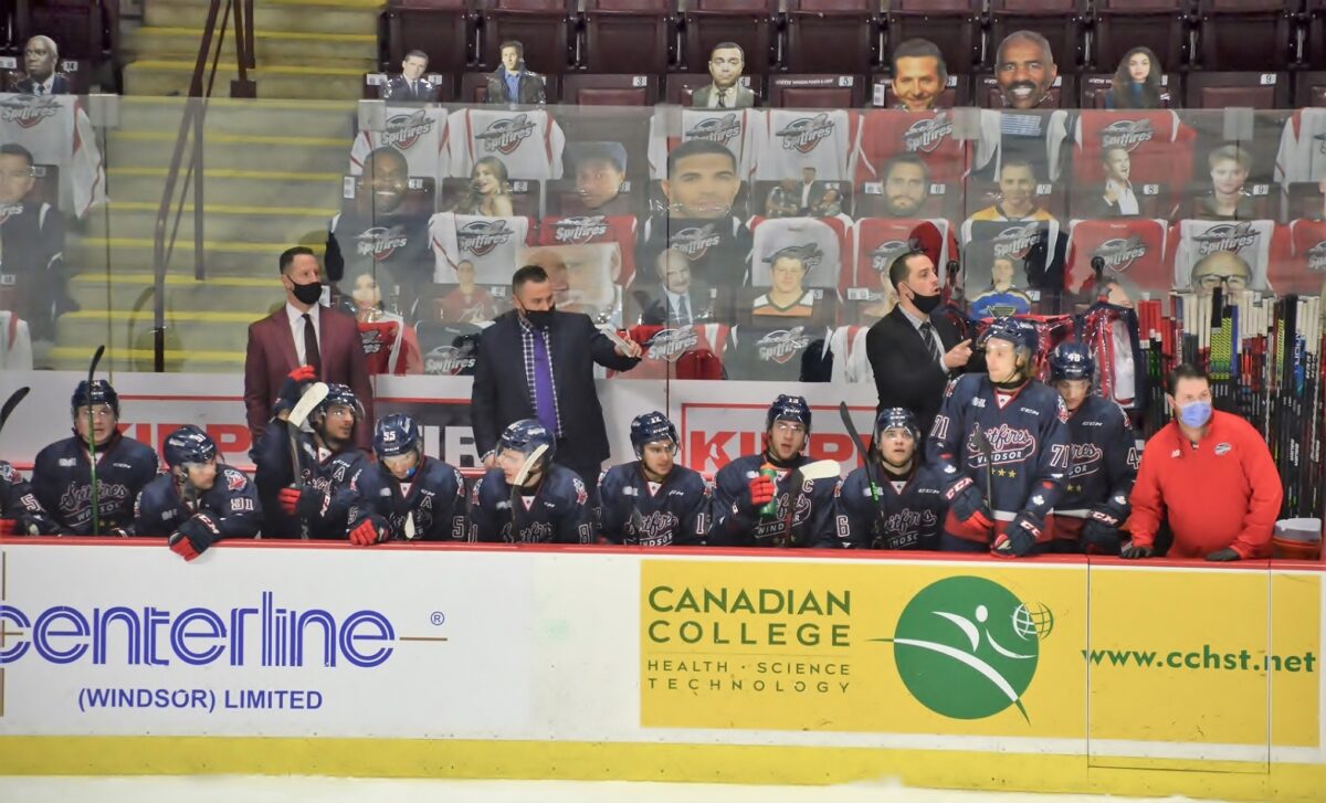 Windsor Spitfires' coaches Andy Delmore (L), Marc Savard (C), and Jerrod Smith (R)