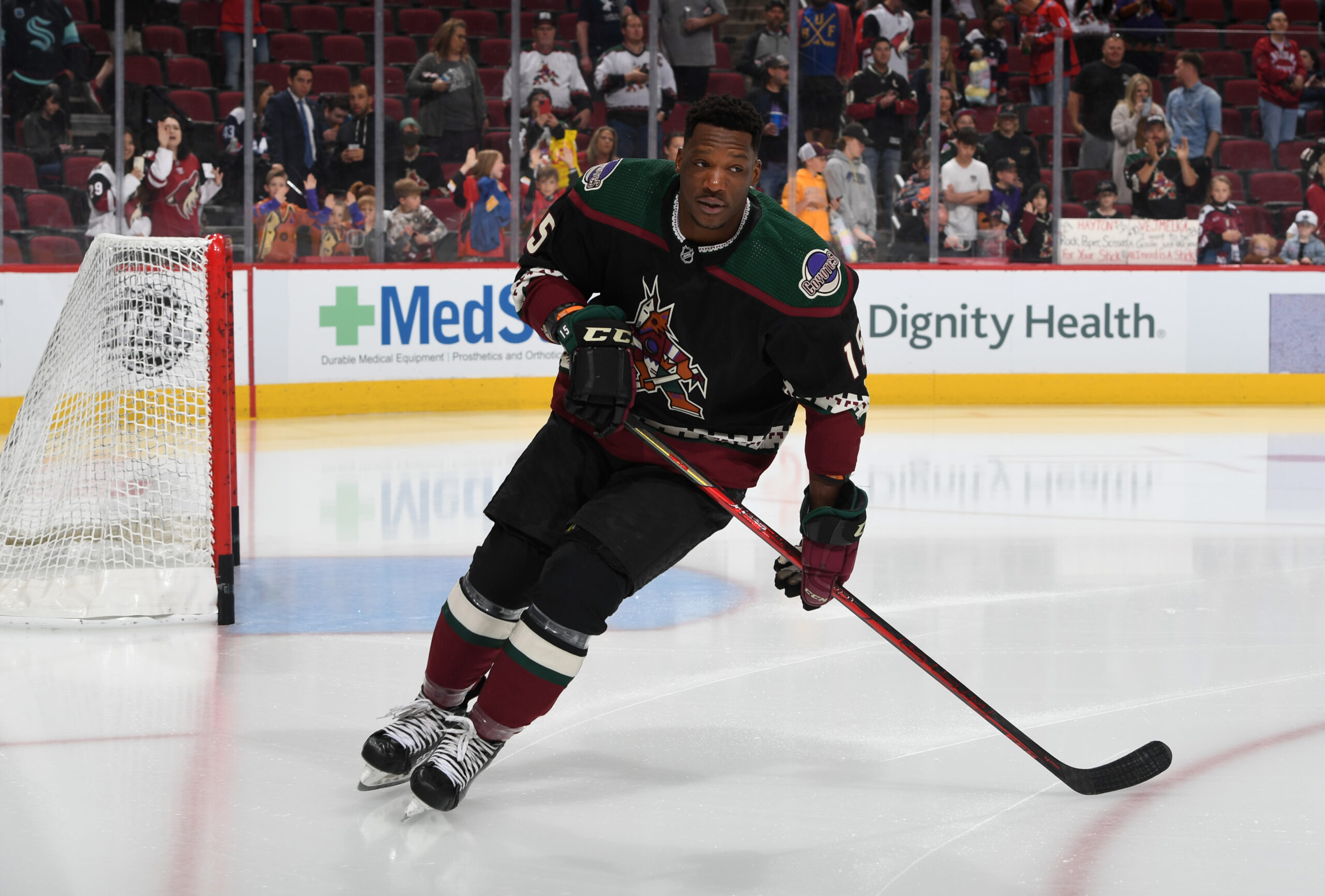 Arizona Coyotes' Bokondji Imama lines up for a faceoff during the second  period of the team's NHL hockey preseason game against the Vancouver  Canucks on Friday, Oct. 7, 2022, in Vancouver, British
