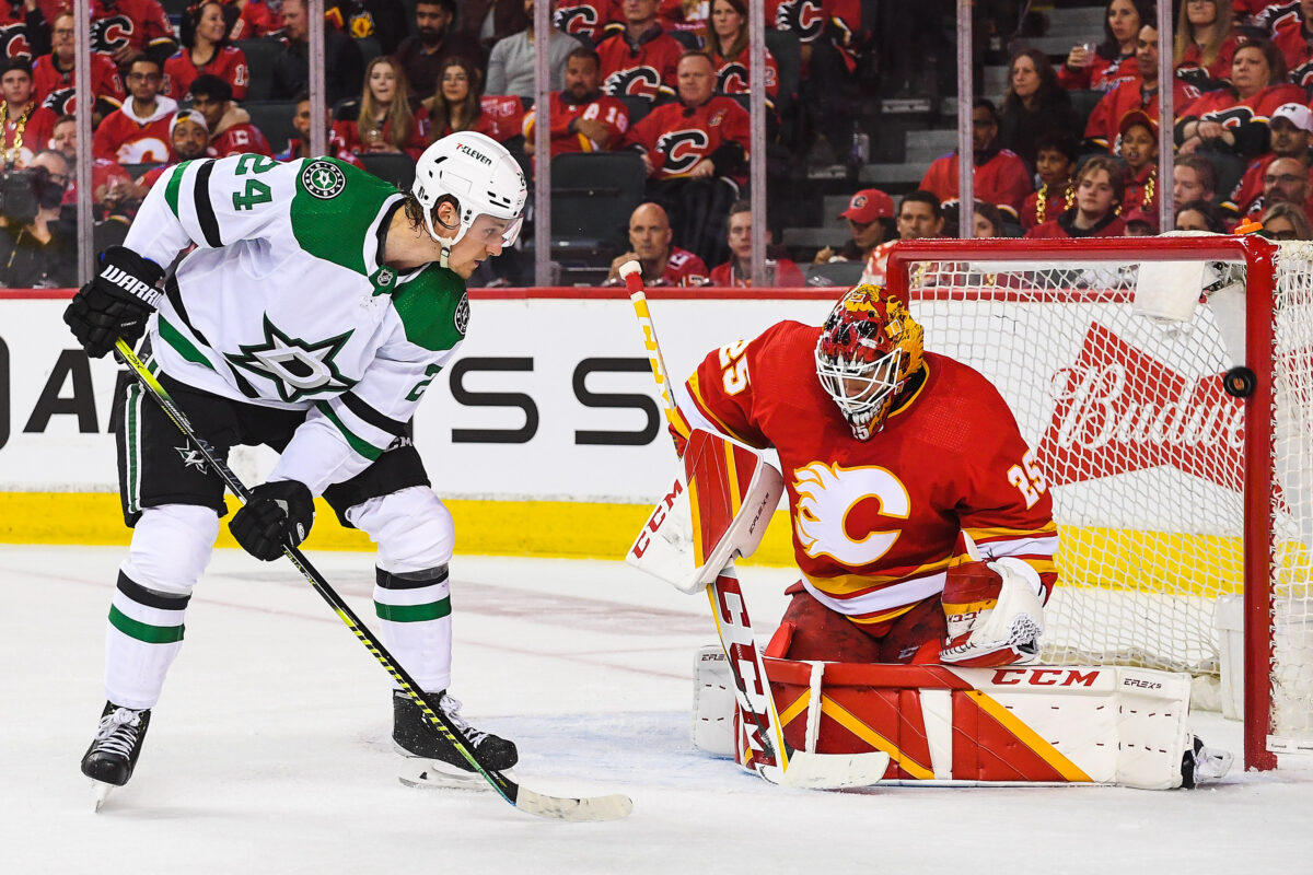 Calgary Flames goaltender Jacob Markstrom makes a save on Roope Hintz of the Dallas Stars (Photo by Derek Leung/Getty Images)