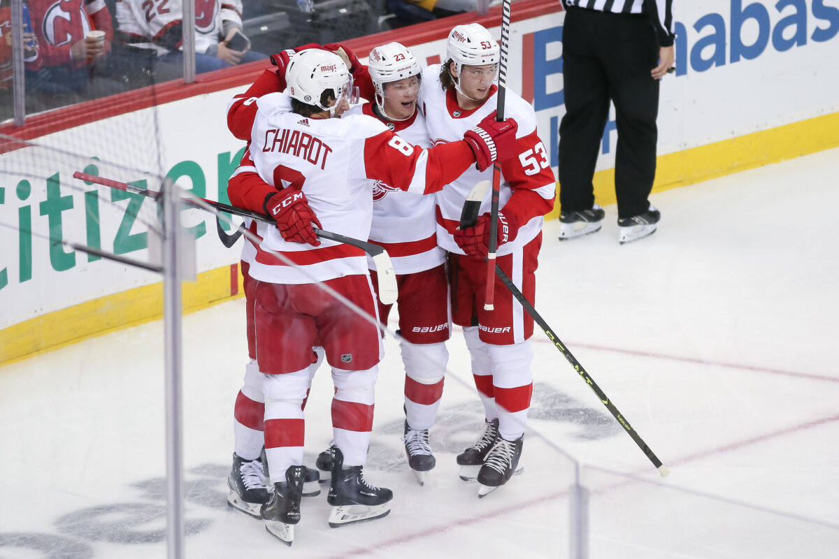 Detroit Red Wings players celebrate a goal.