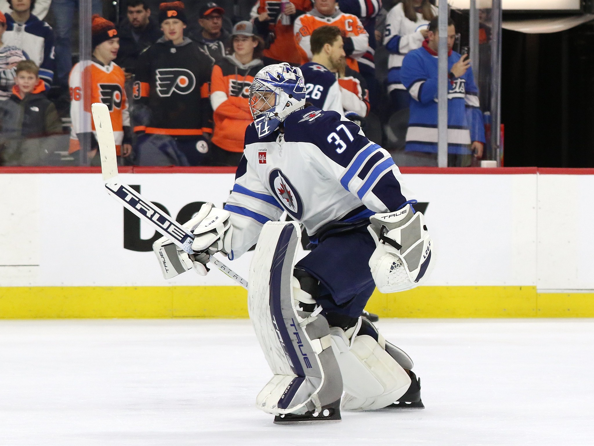 Adam Lowry of the Winnipeg Jets and Ryan Reaves of the New York News  Photo - Getty Images