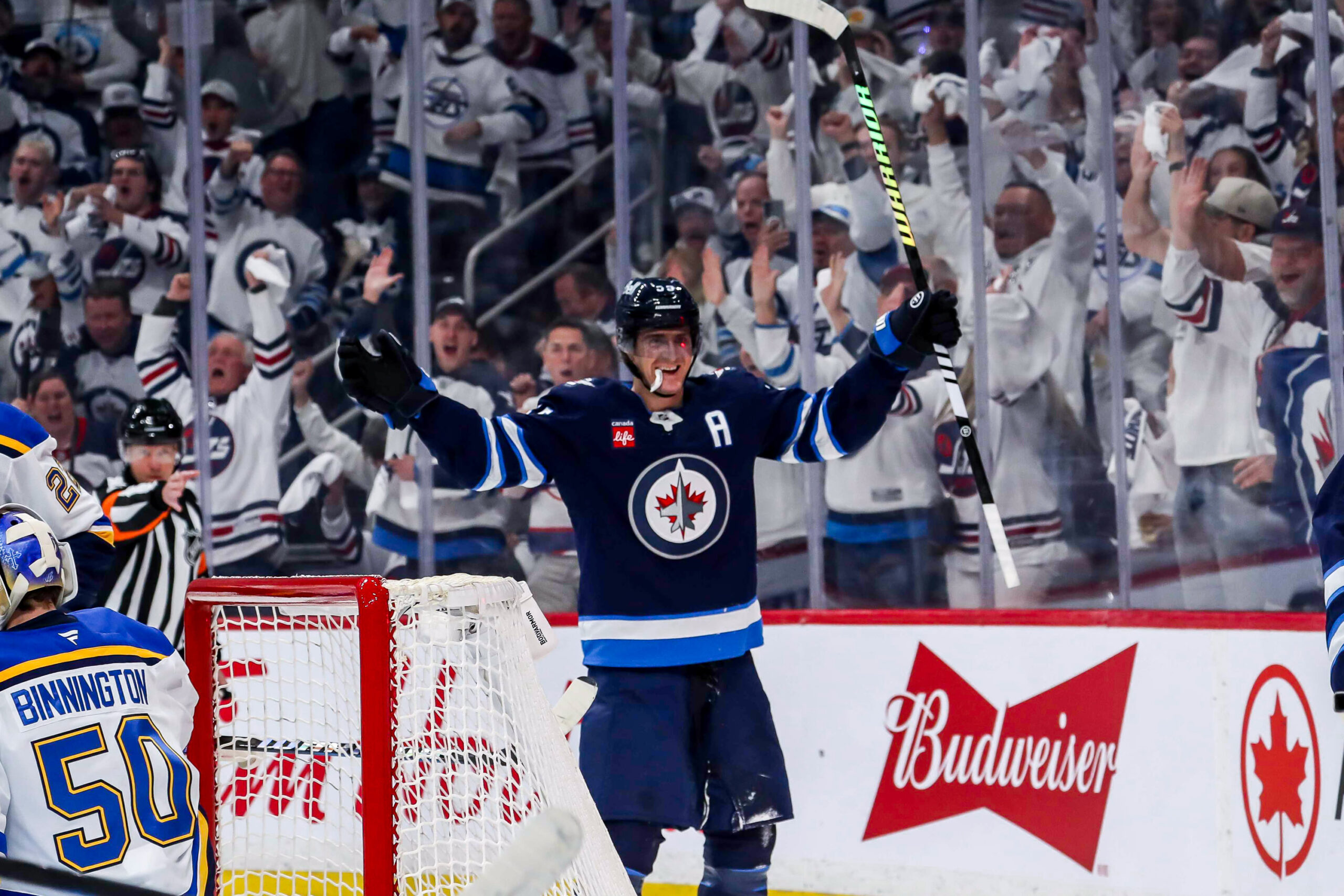 Connor Scores Late to Help Jets Beat Blues 5-3 in Game 1