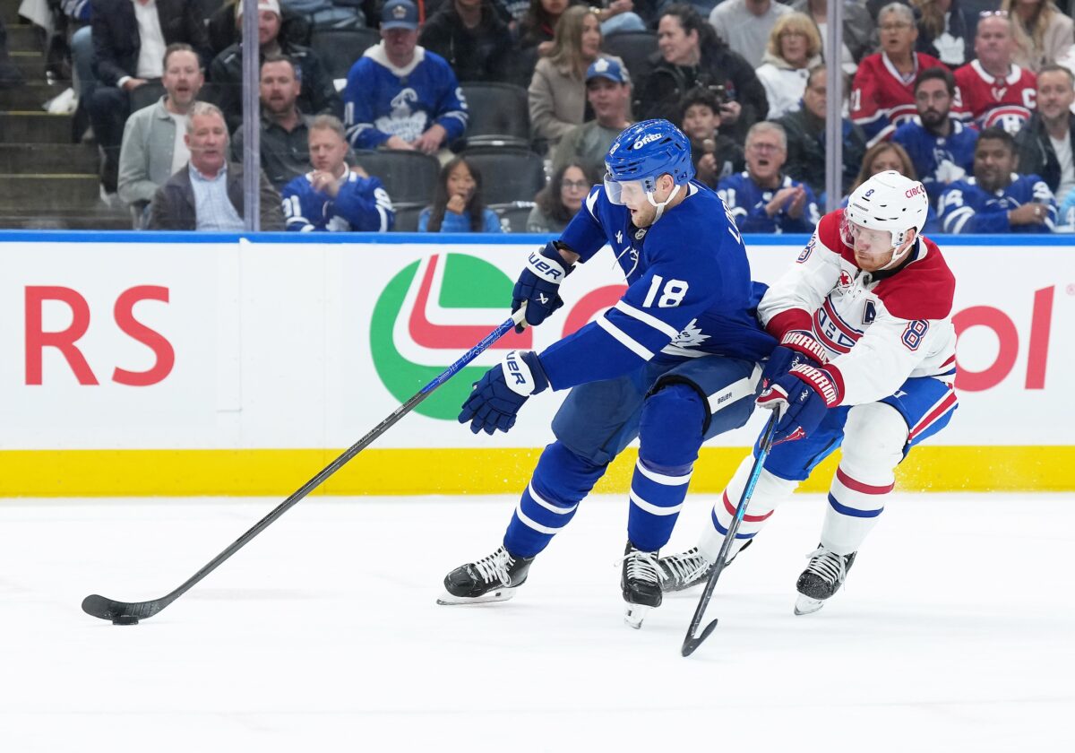 Toronto Maple Leafs Steven Lorentz battles for the puck with Montreal Canadiens Mike Matheson